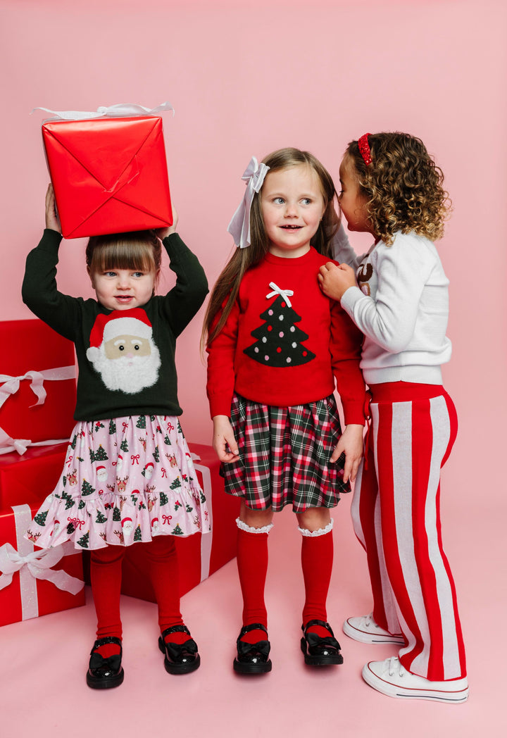 three little girls' with Christmas gifts in red, pink, white and forest green mix and match outfits
