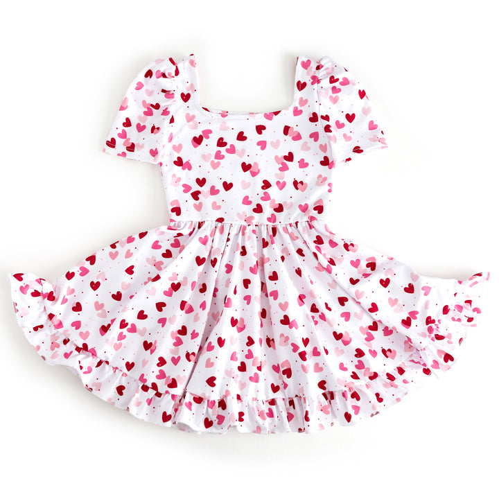 girls white square neck twirl dress with scattered hearts in shades of red and pink for Valentine's Day