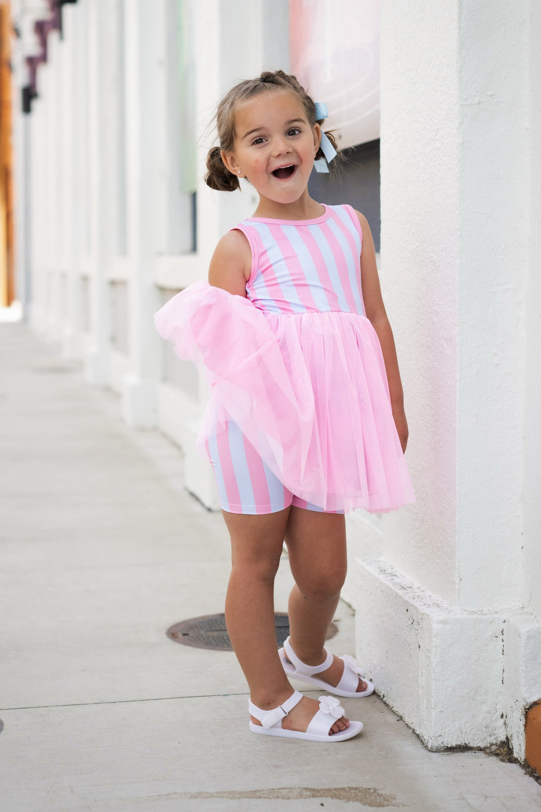 girl wearing pink and blue stripe tutu set with matching shorts