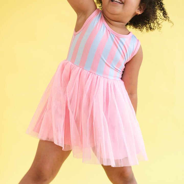 little girl in blue and pink cotton candy striped tutu dress