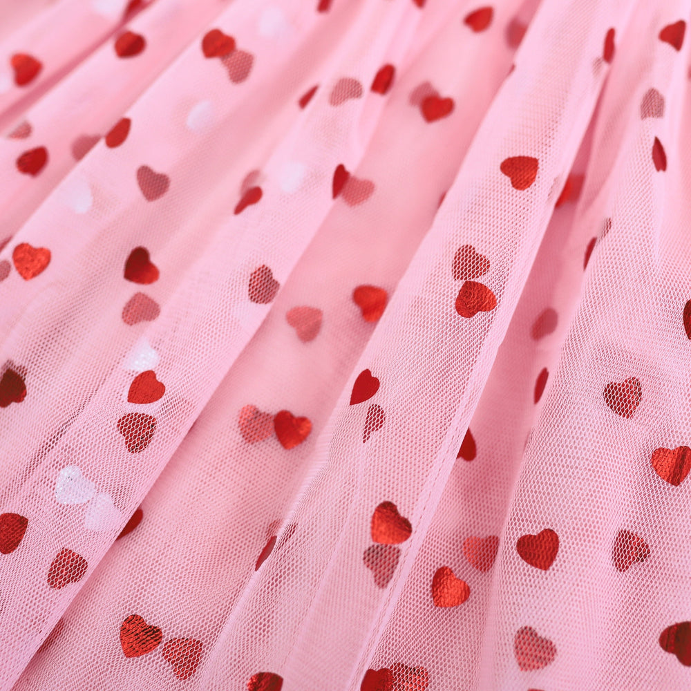 detail photo of red foil hearts on pink tulle for girl's Valentine's Day dress