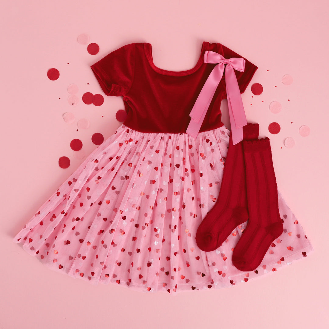 girl's Valentine's dress with red velvet bodice and pink tulle skirt with red hearts, matching red knee highs and pink satin bow