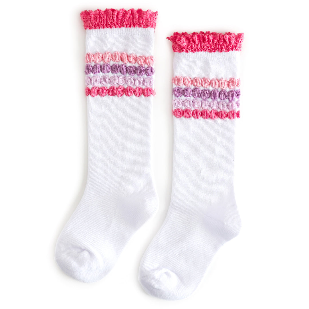 girls' white knee high socks with pink ruffle trim and raised bubble stripe detail in shades of pink and lavender