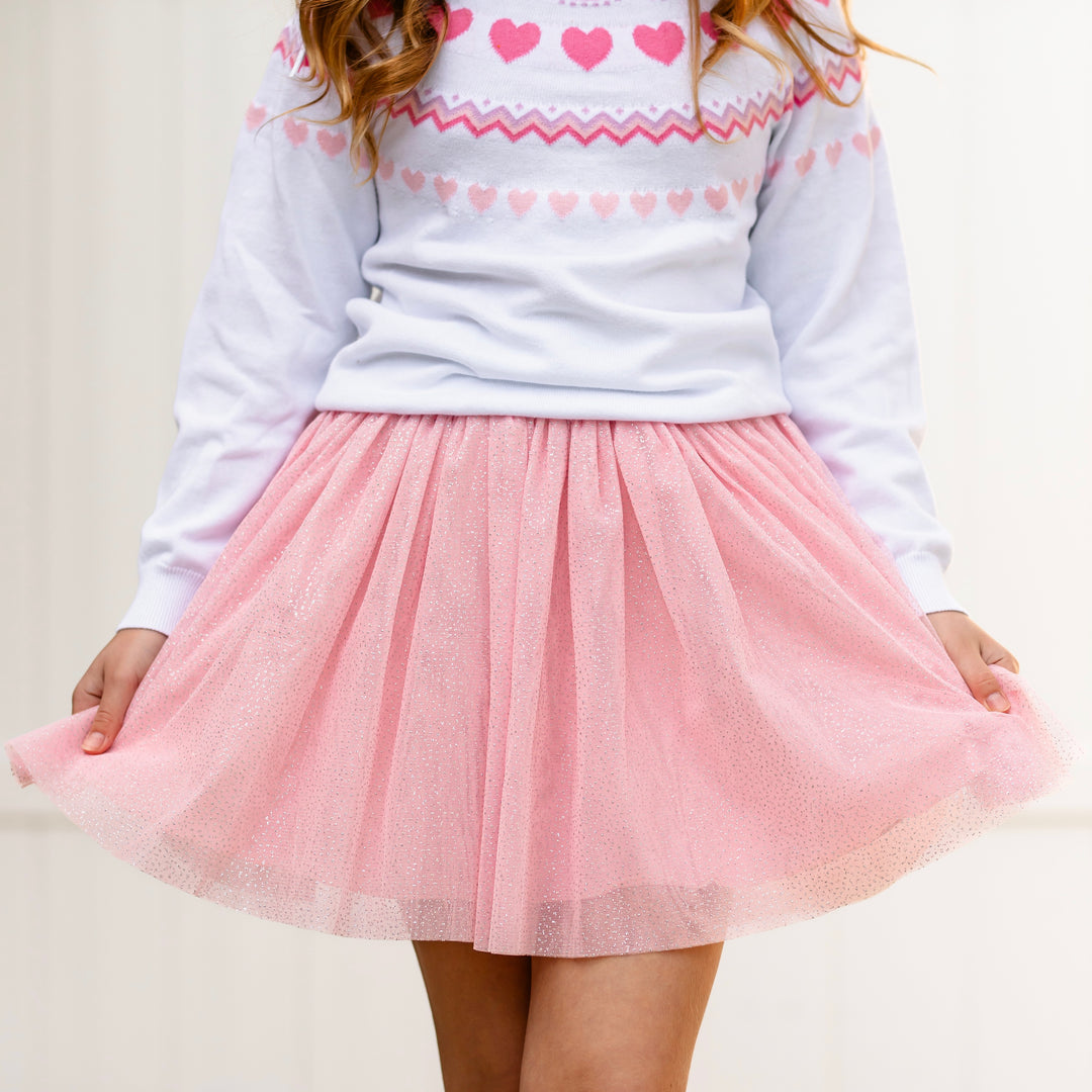 close up of light pink sparkly tulle skirt paired with white fair isle heart sweater for Valentine's Day