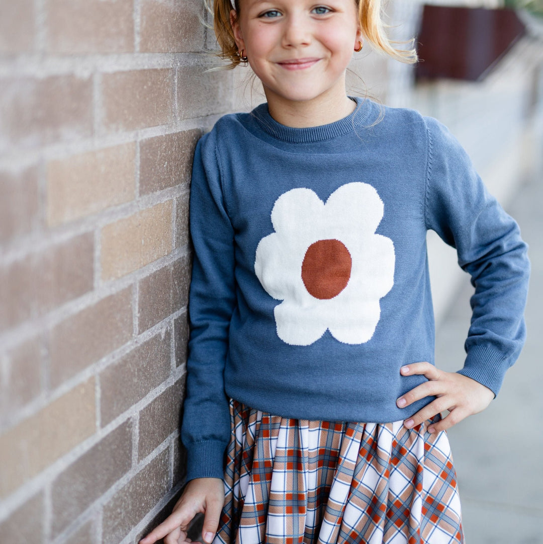 little girl wearing fall plaid twirl dress with matching flower design pullover sweater