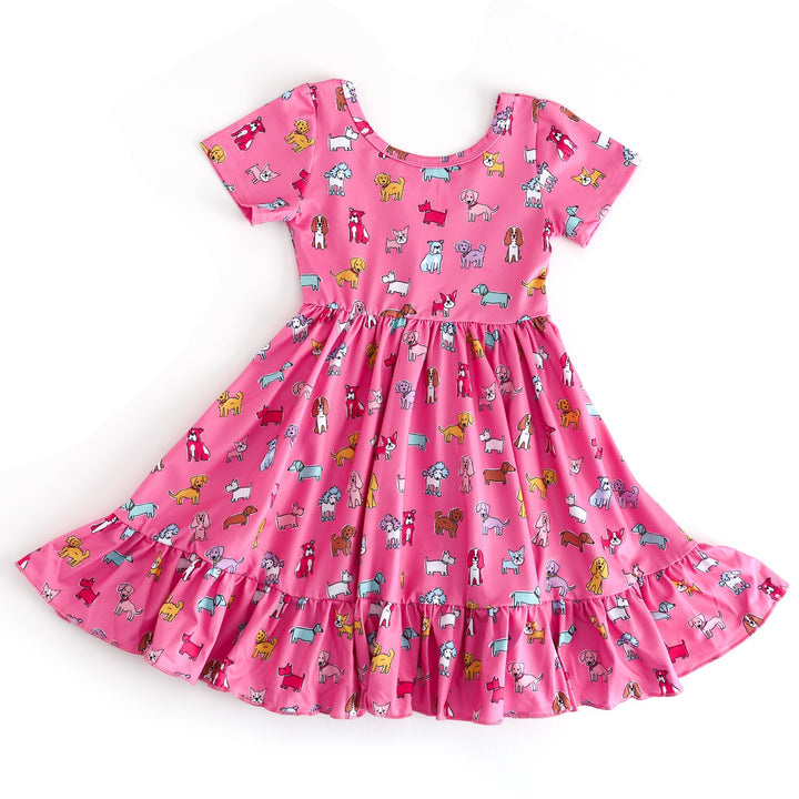 Pink dress with dog pattern on a white background