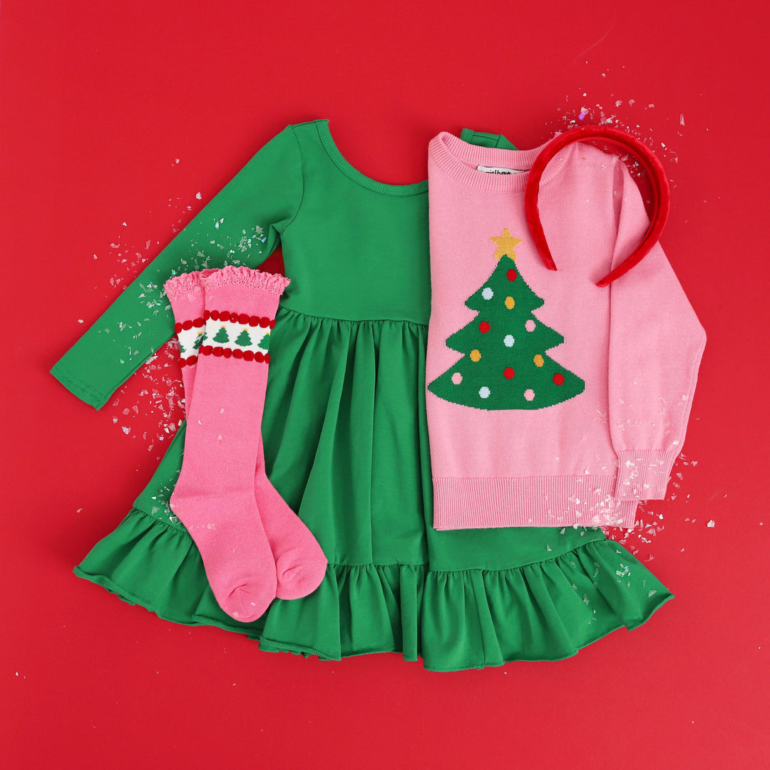 girls green twirl dress with matching pink christmas tree sweater and knee high socks