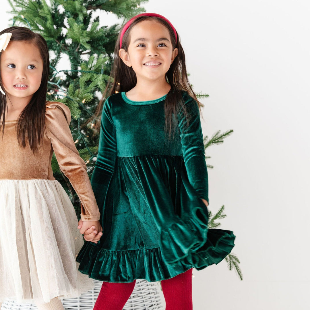 girls wearing christmas party dresses velvet and tulle