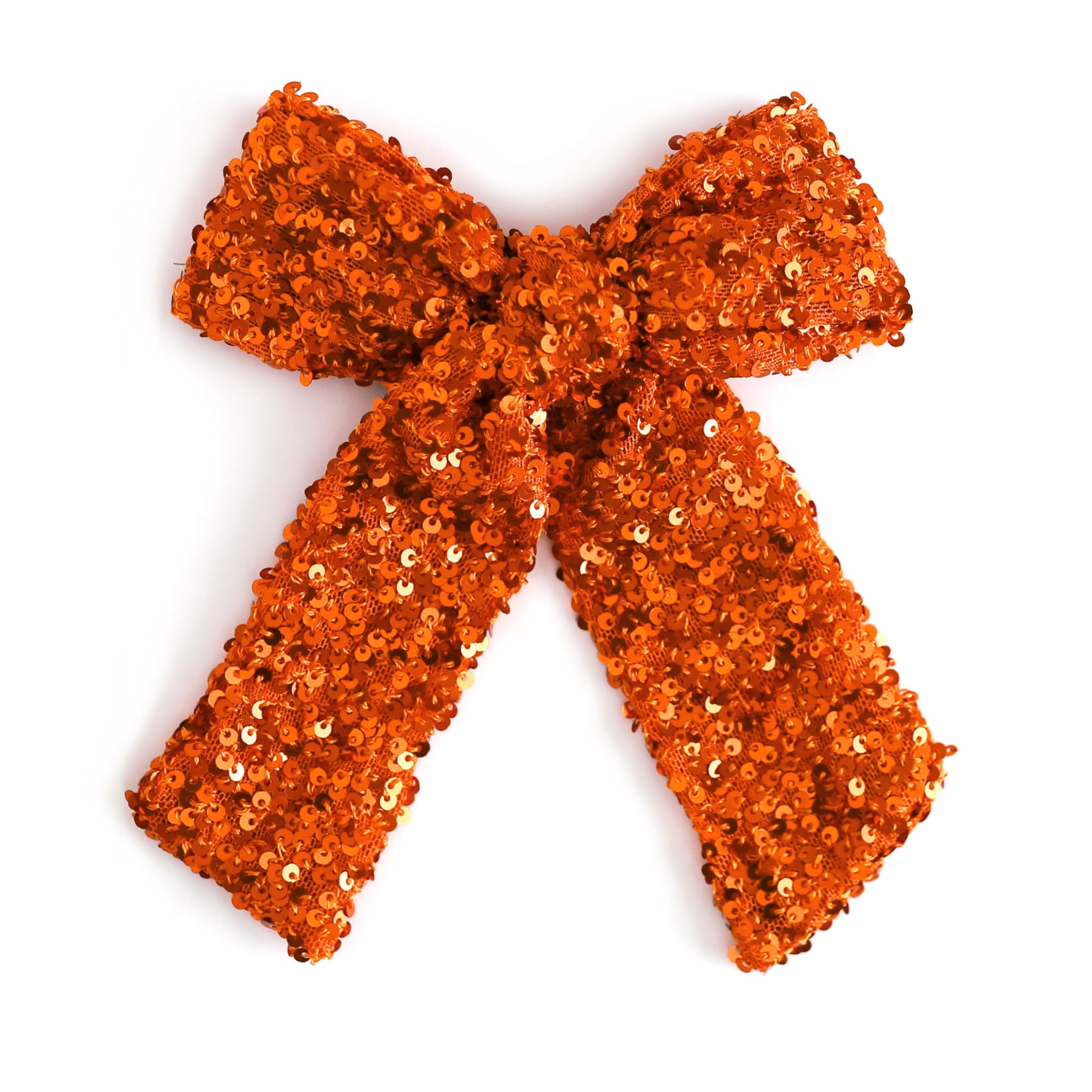 girl's sequin covered orange bow on clip for fall and Halloween