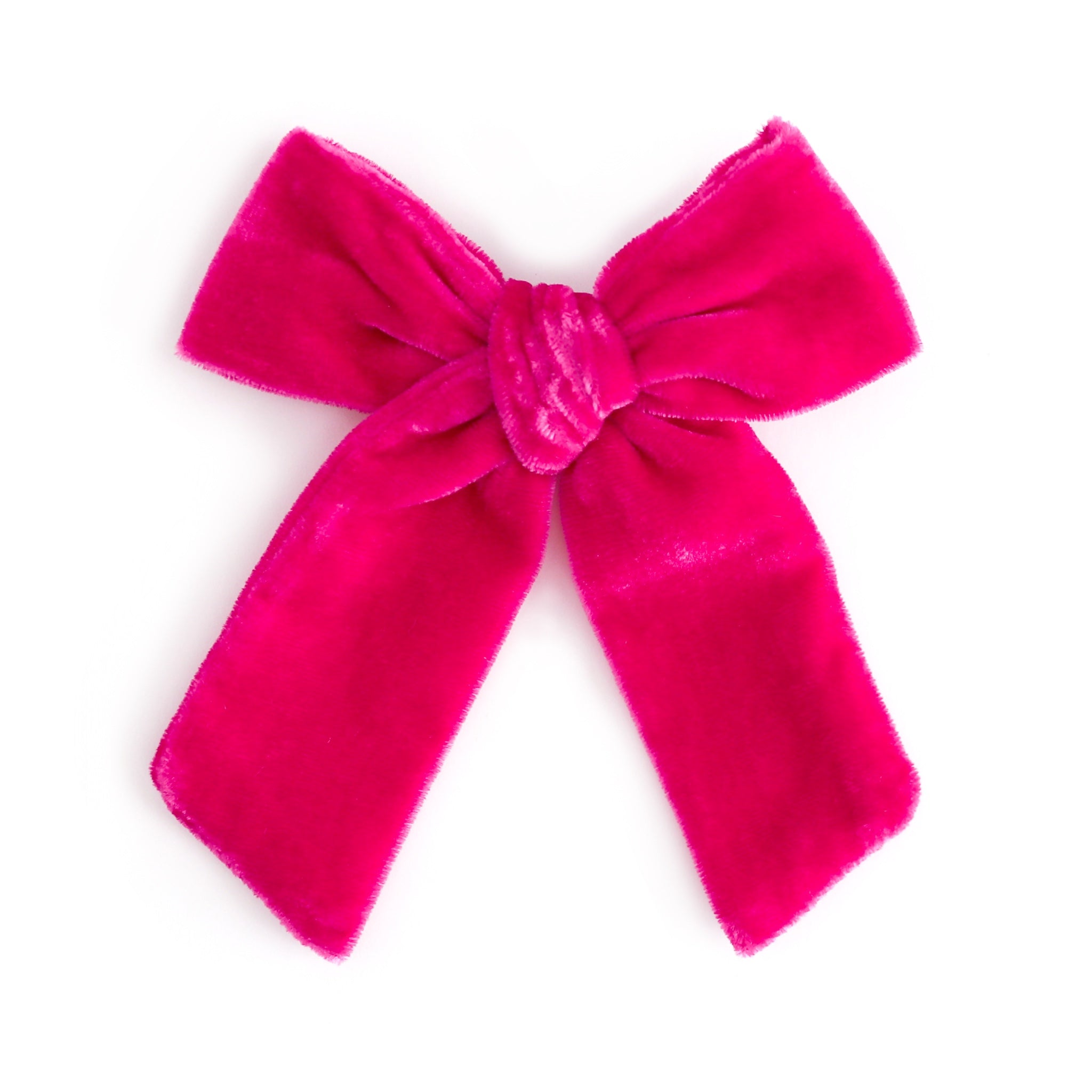 girl's oversized bright pink velvet bow on alligator clip