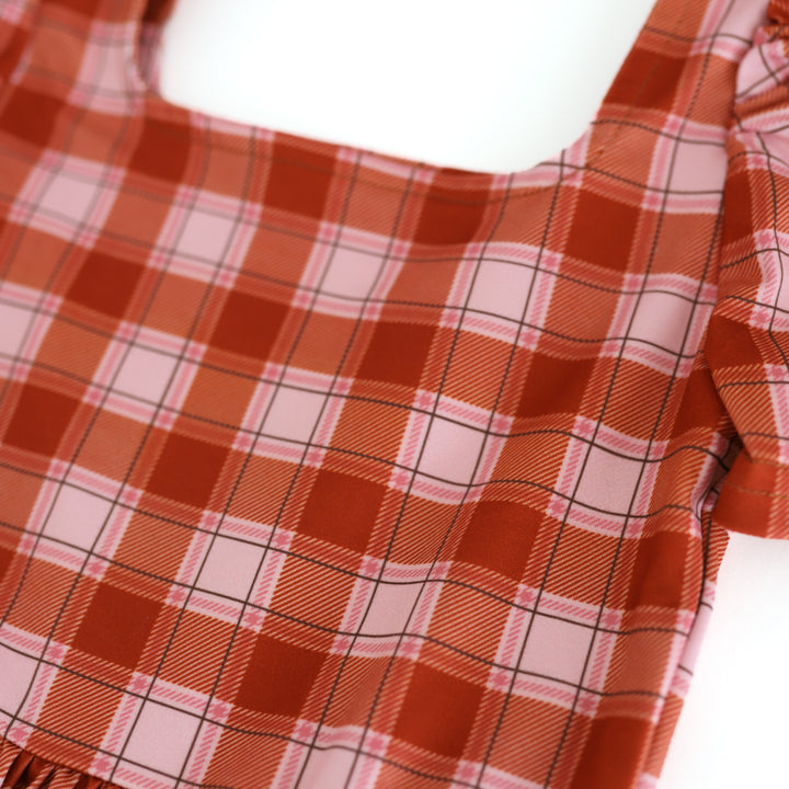 detail photo of pumpkin orange plaid twirl dress bodice