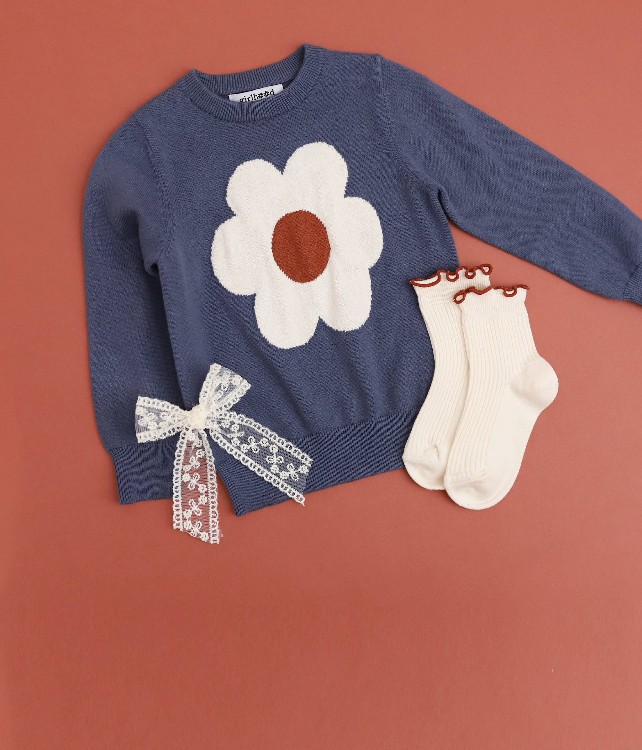 girls' denim blue pullover sweater with ivory and sugar almond flower paired with matching ivory lettuce trim midi socks and ivory lace bow