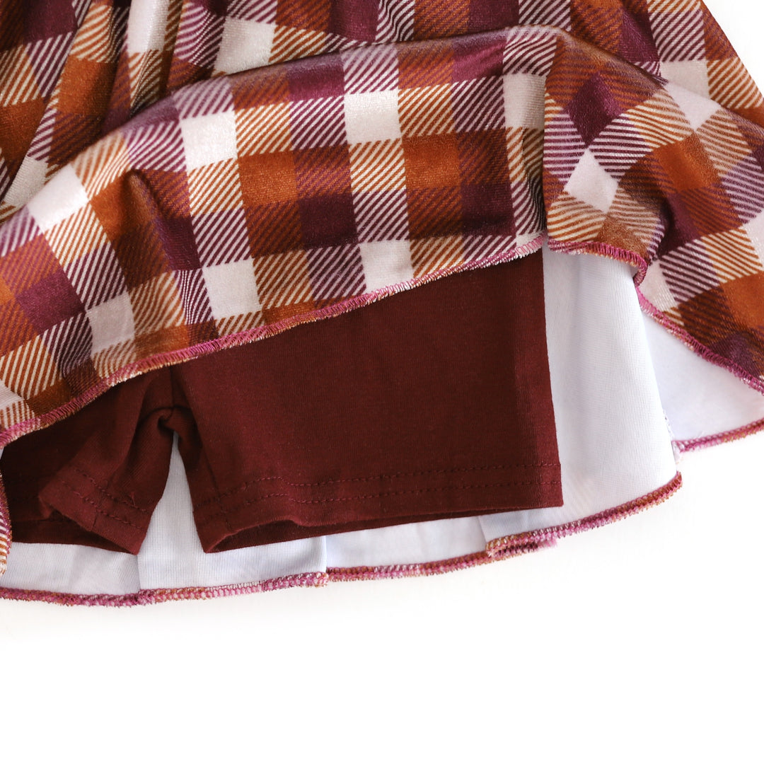 closeup of cotton blend burgundy built in shorts for fall velvet plaid skort