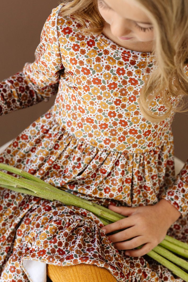 pattern closeup of fall velvet floral twirl dress in shades of mustard, pumpkin spice, olive and cream