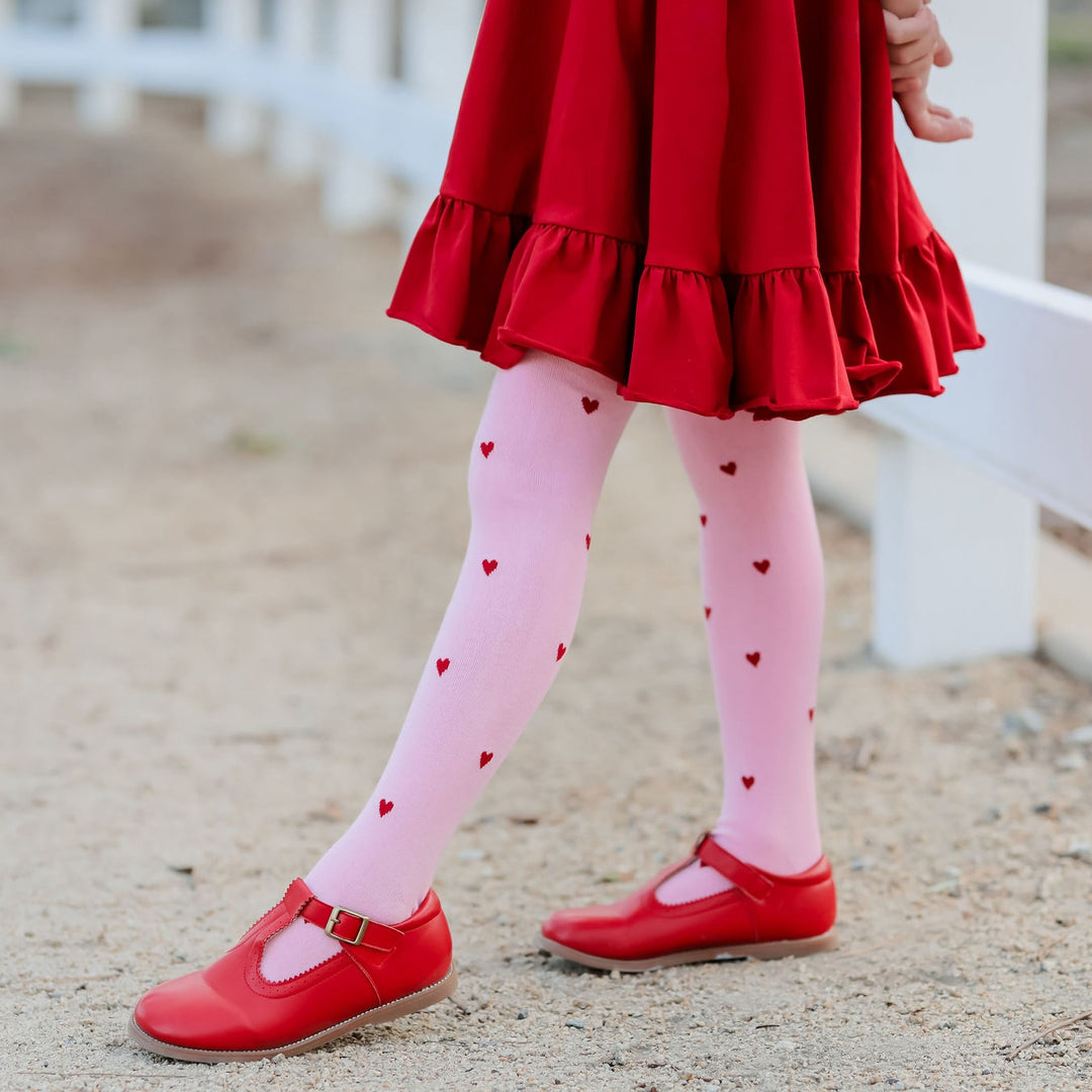 little girls red dress with pink and red heart tights for valentines day