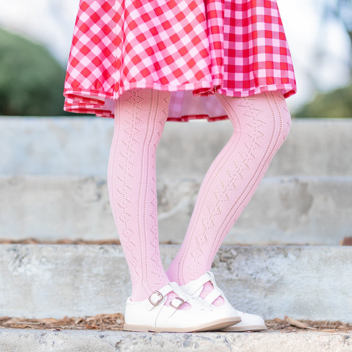 girls open knit tights in light pink paired with red and pink gingham dress for Valentine's Day