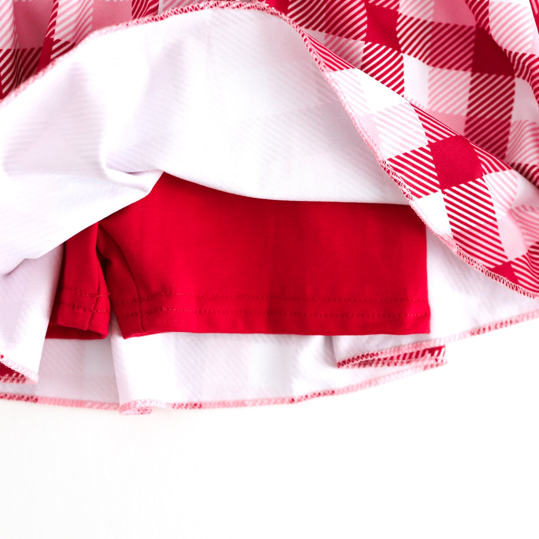 closeup of red cotton blend shorts attached to red, pink and white plaid valentines skort