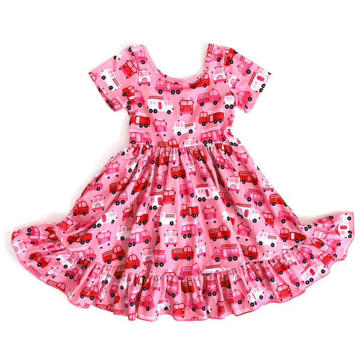 girls pink twirly dress with red, pink and white firetruck print for Valentine's Day