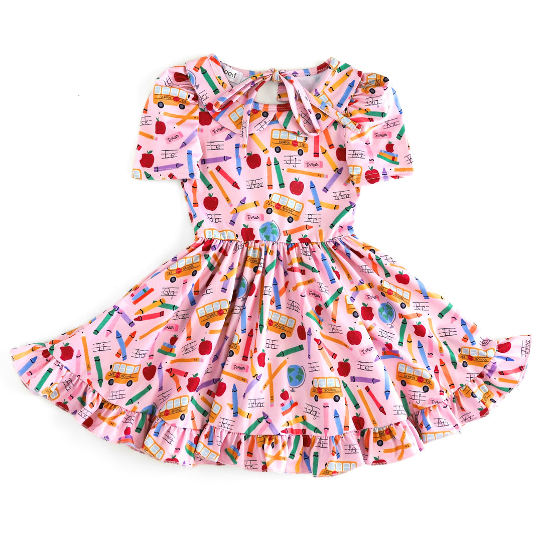 girls' short sleeve collared twirl dress with school bus and colorful school supplies printed on pink