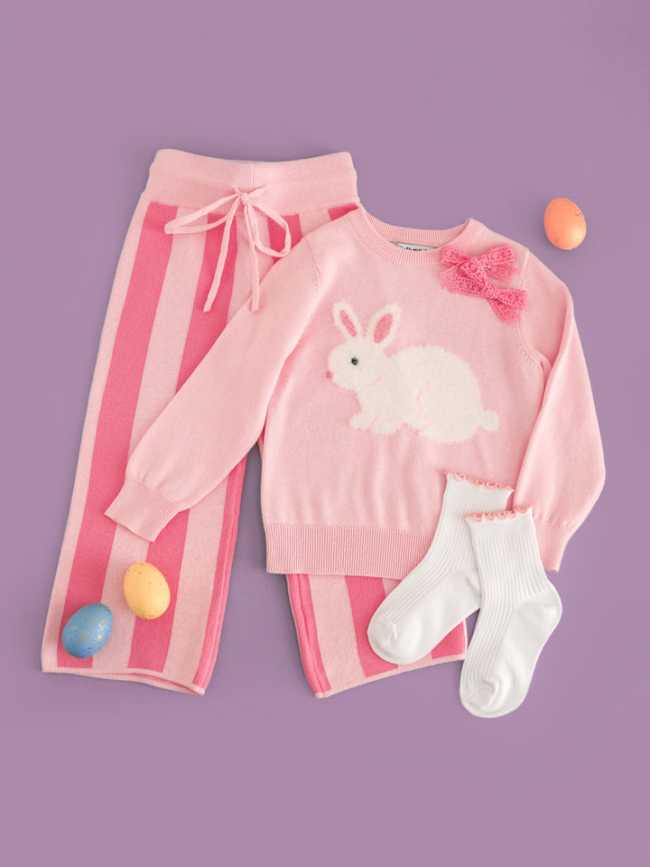 girls' Easter sweater set featuring pink cotton knit sweater with white fluffy bunny design paired with matching two tone sweater pants, midi socks and pink lace pigtail bows