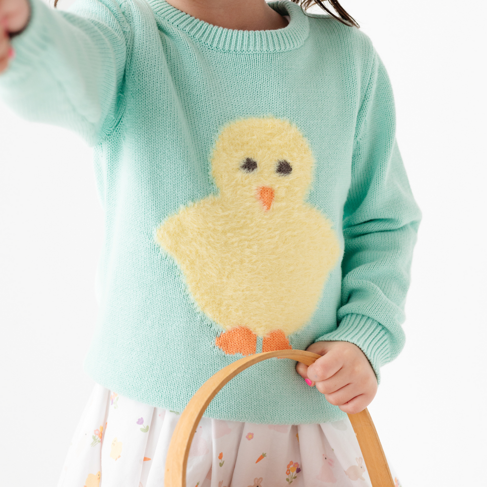 detail of fluffy chick easter sweater 