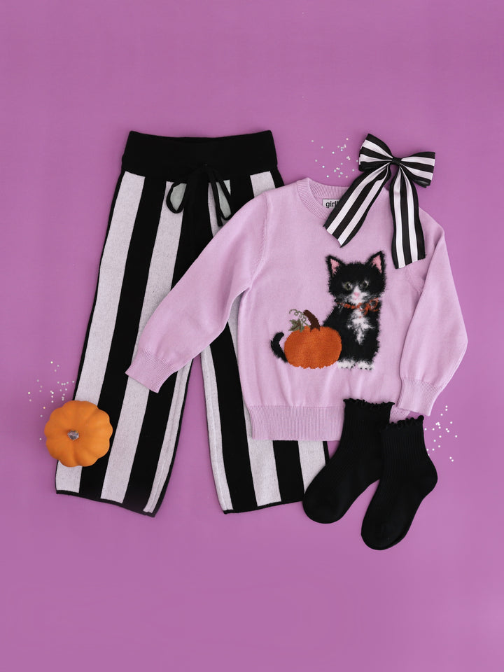 girl lavender cotton knit sweater with fluffy kitten and sparkly pumpkin design paired with black and white striped sweater pants and hair bow