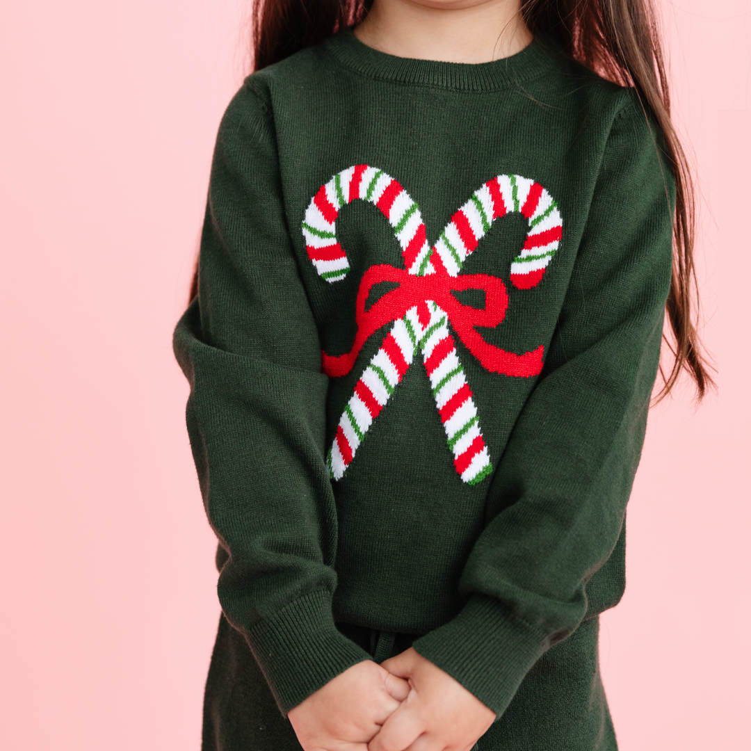 forest green christmas sweater with candy canes and red bow