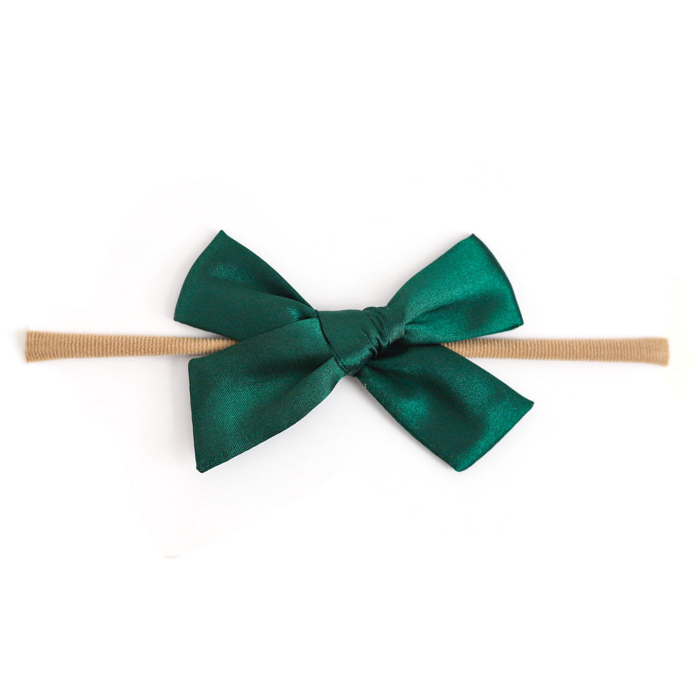 shiny green satin bow on soft nylon band for baby girl's first Christmas