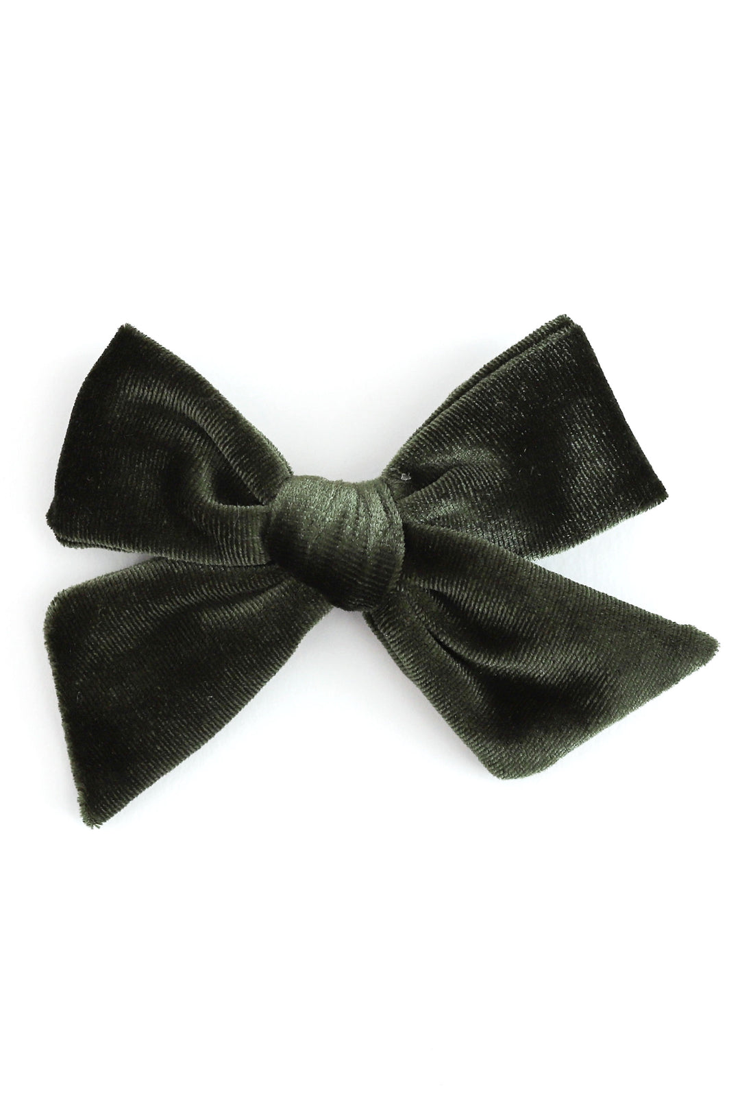 A dark green velvet hair bow clip photographed against a solid white background.