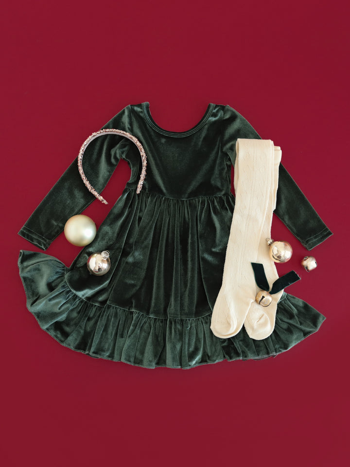 girls' forest green long sleeve velvet Christmas dress with sparkly gold headband and cream cable knit tights
