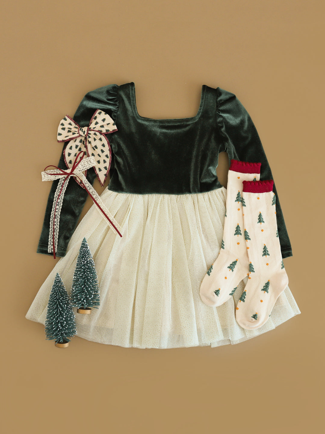 girls fancy forest green long sleeve velvet dress with cream sparkly tulle skirt paired with Christmas tree socks and bow