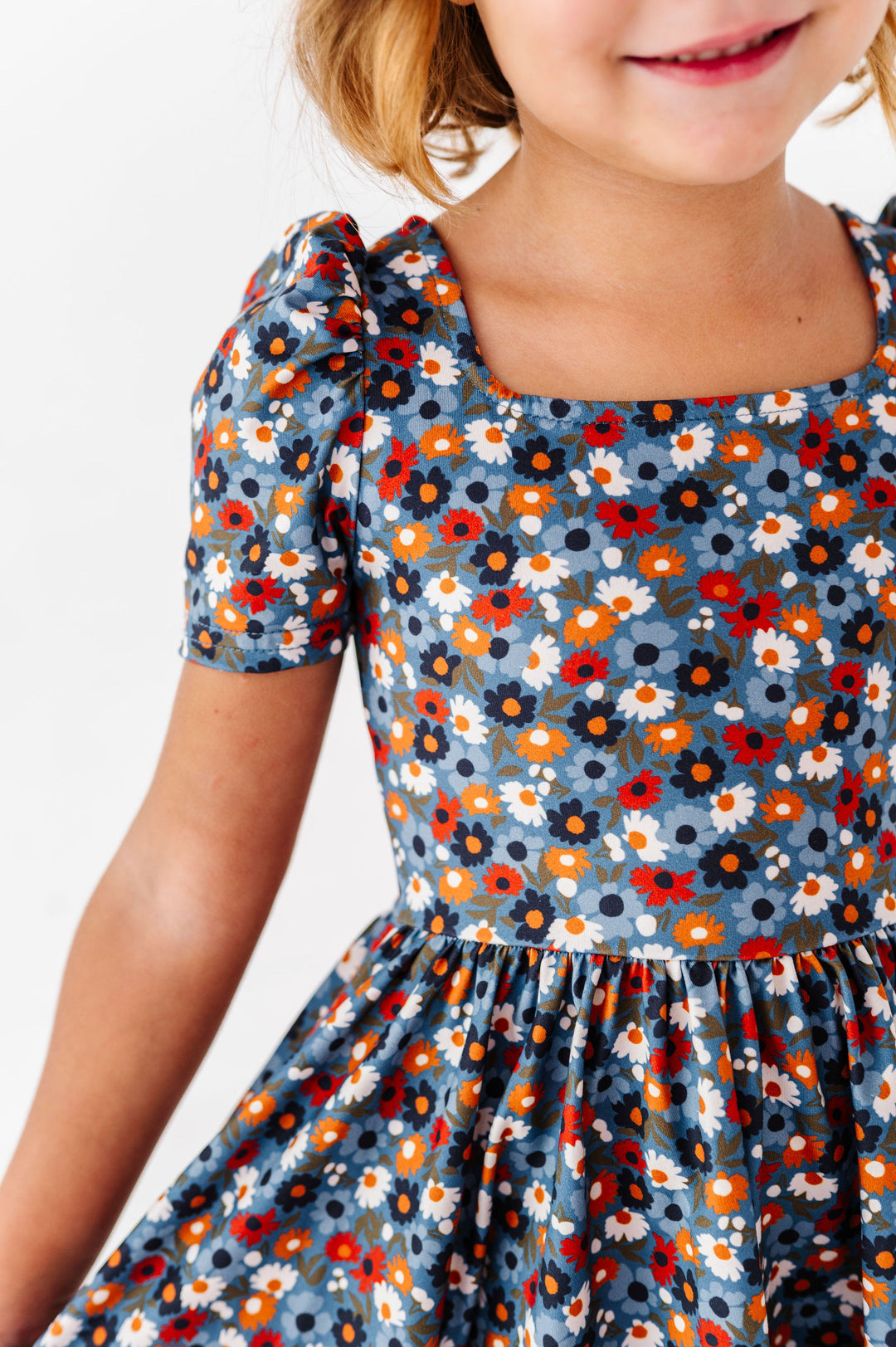 details of blue fall floral dress with square neckline