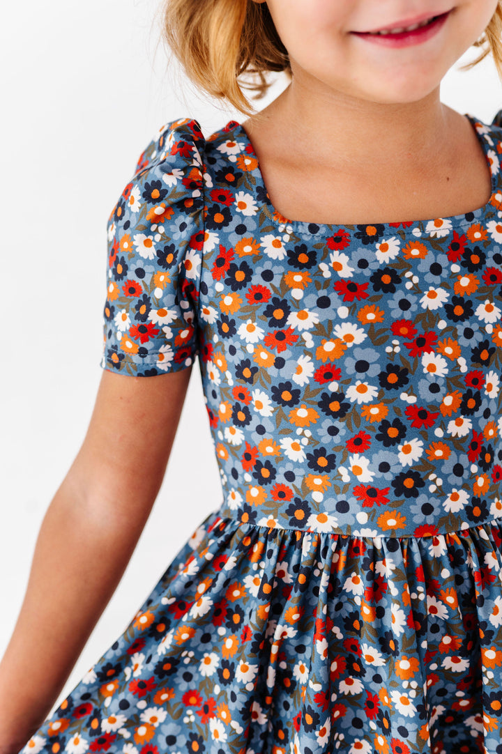 details of blue fall floral dress with square neckline