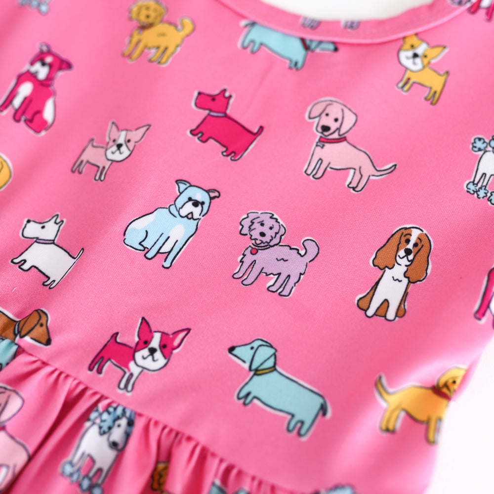 Pink fabric with colorful dog pattern