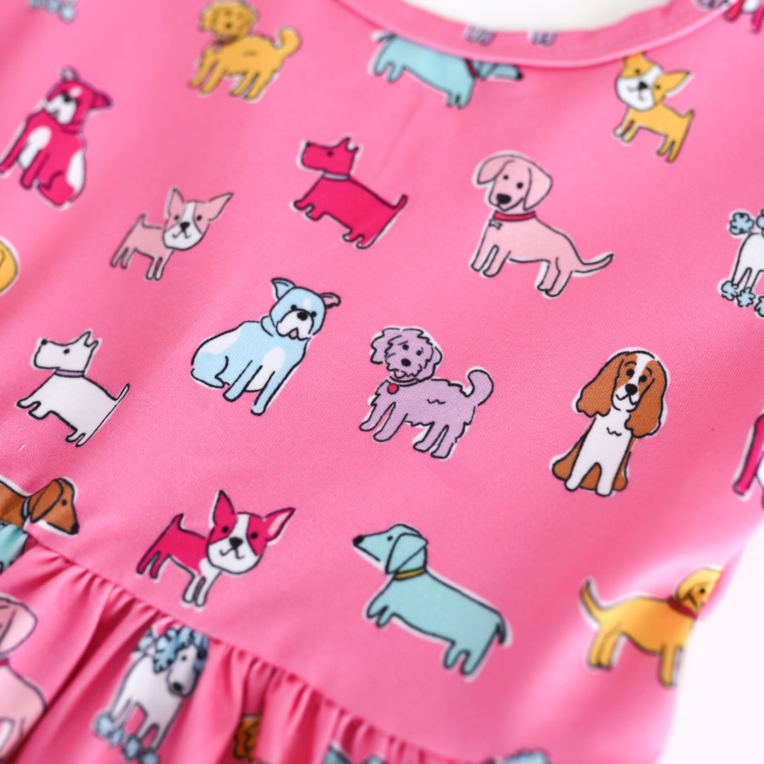Pink fabric with colorful dog pattern