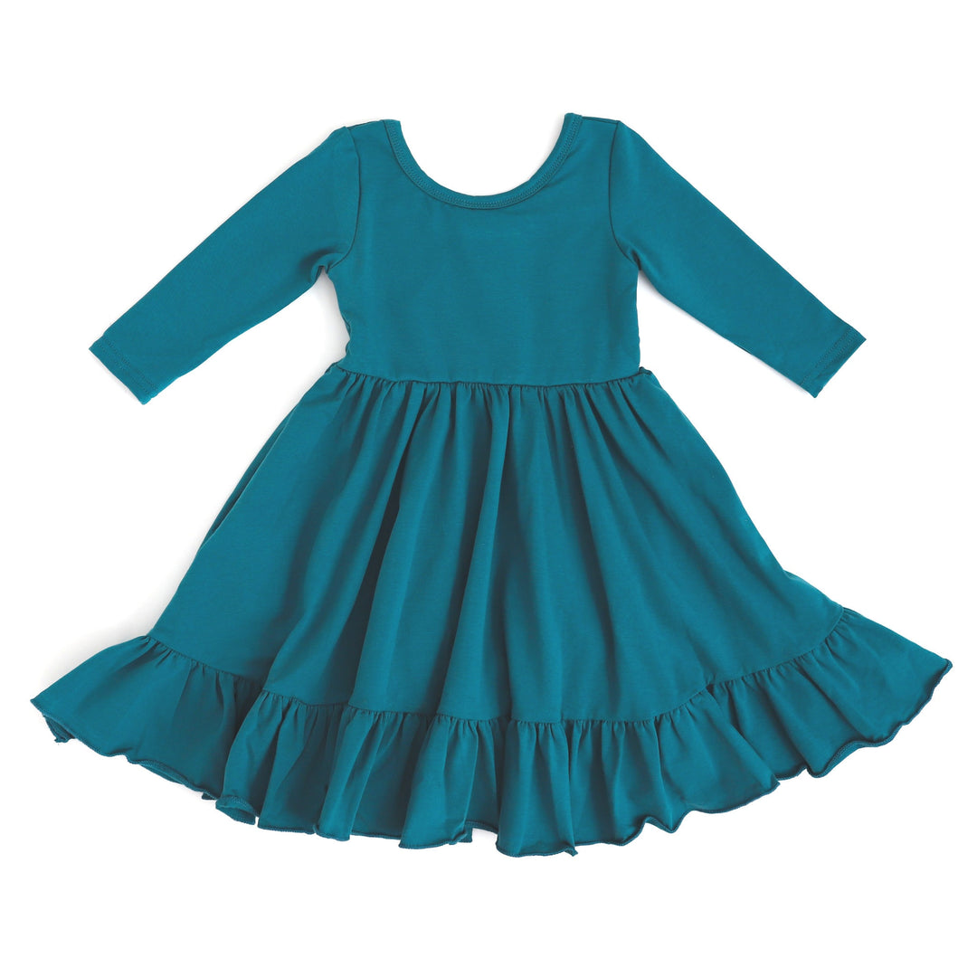 girls teal twirl dress with long sleeves and pockets
