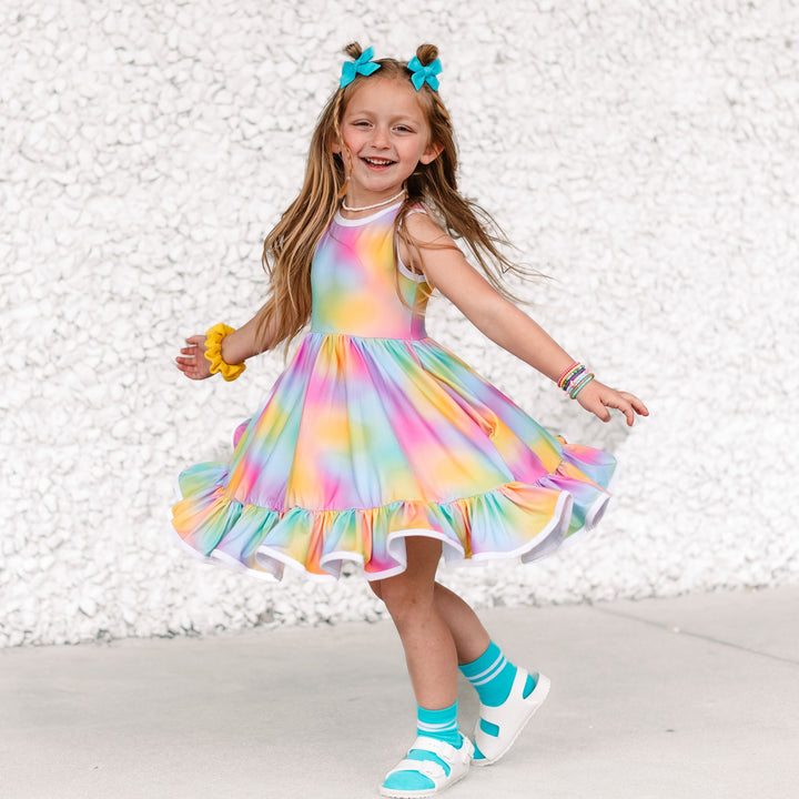 little girl twirling in rainbow tie-dye tank style twirl dress