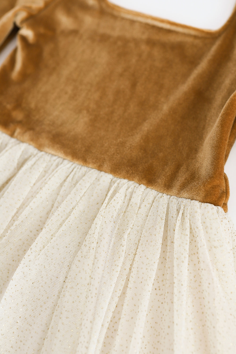 close detail of vanilla and gold sparkle golden tutu christmas dress