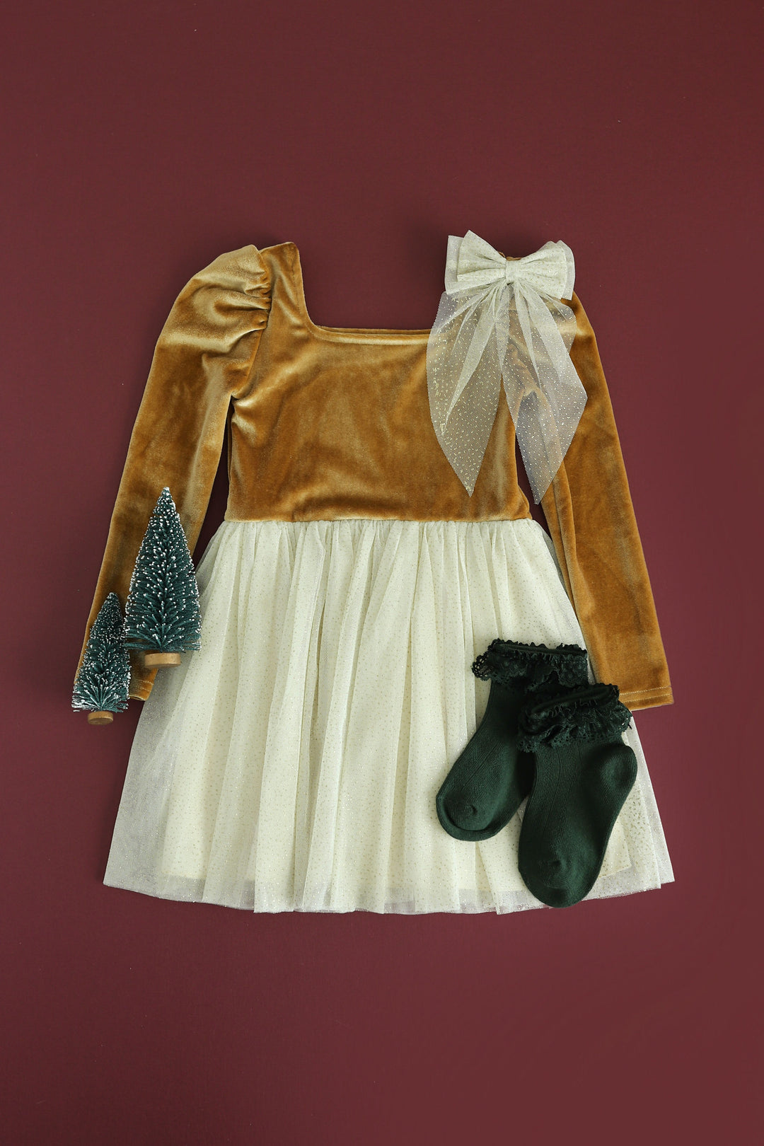 festive girls christmas outfit with gold velvet dress, sparkly tulle, forest green fancy bobby socks and matching tulle hairbow