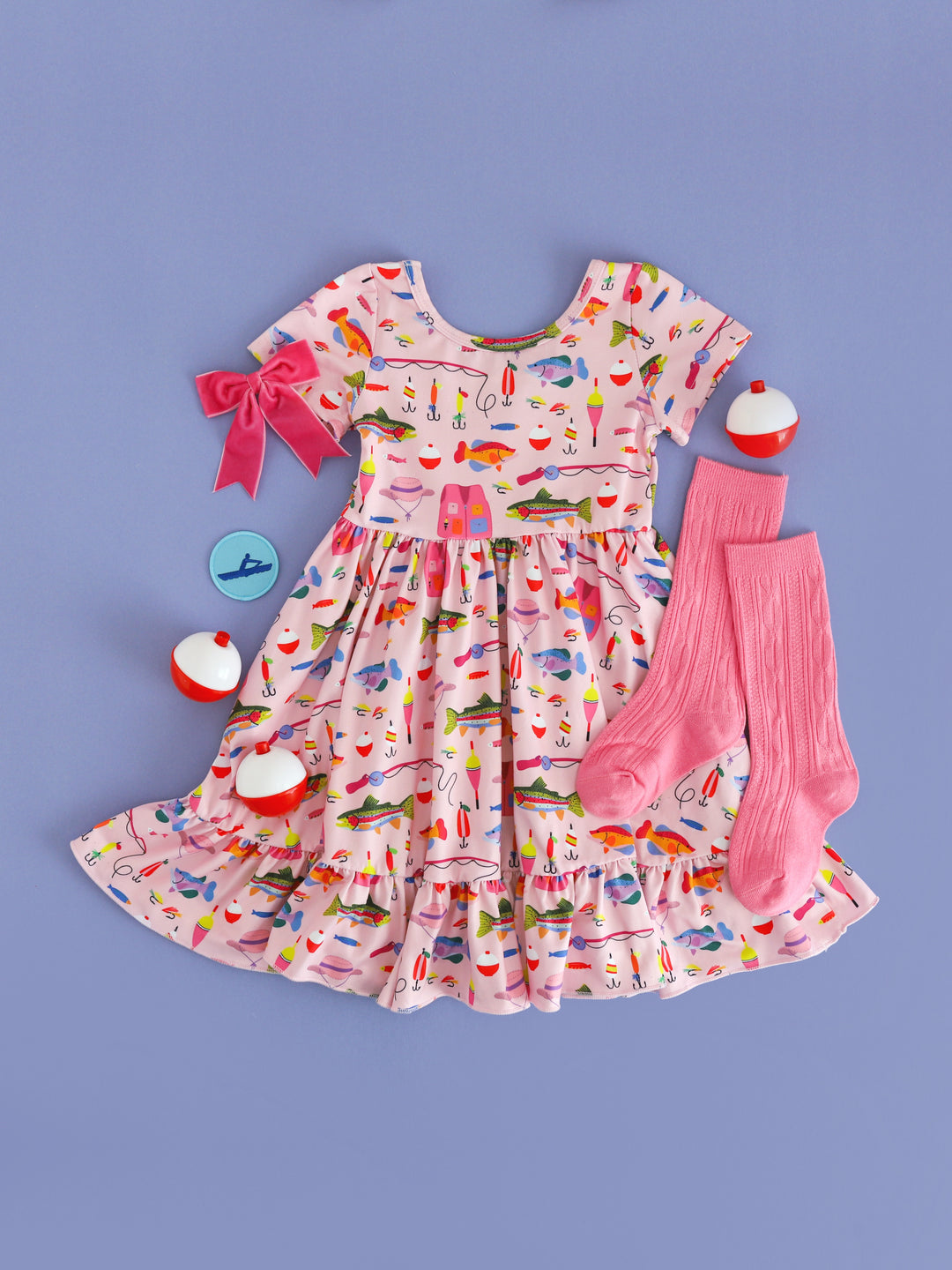 styled photo for girls' pink fishing themed twirl dress with matching pink knee high socks and velvet pink ribbon bow on clip
