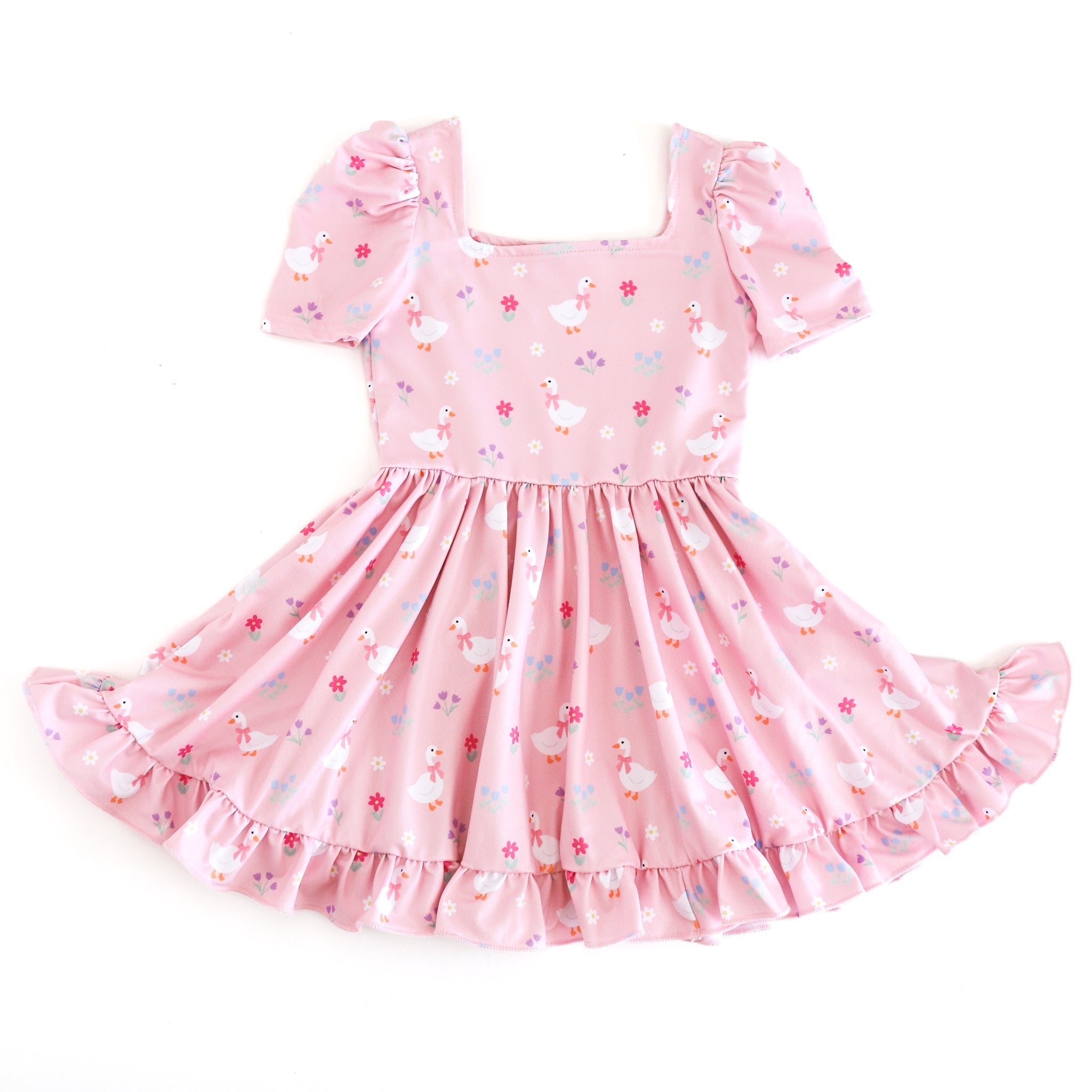 girls' light pink twirl dress with white goose and floral print for spring and Easter 