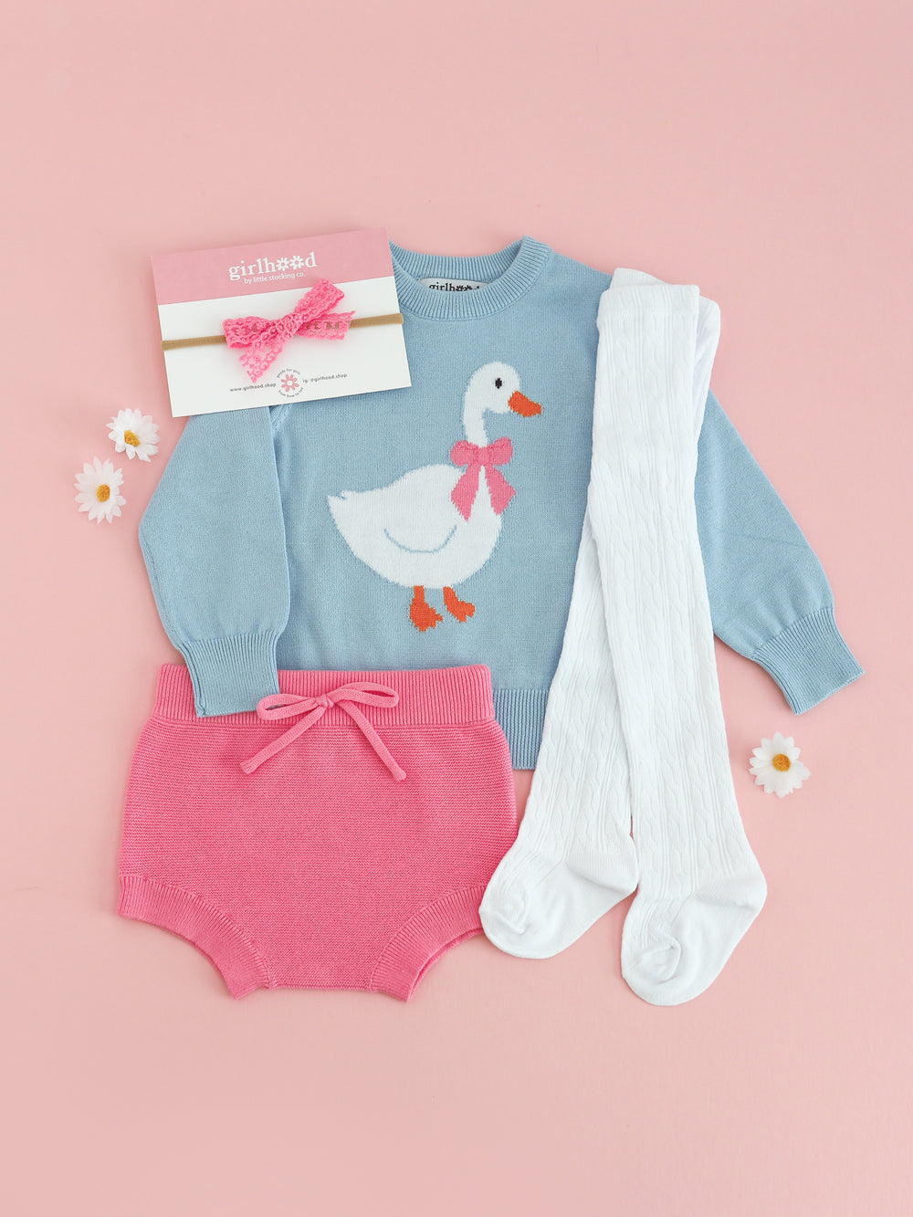 baby girl blue knit sweater with goose design paired with pink baby knit bloomers, white tights and pink lace bow on nylon for Easter