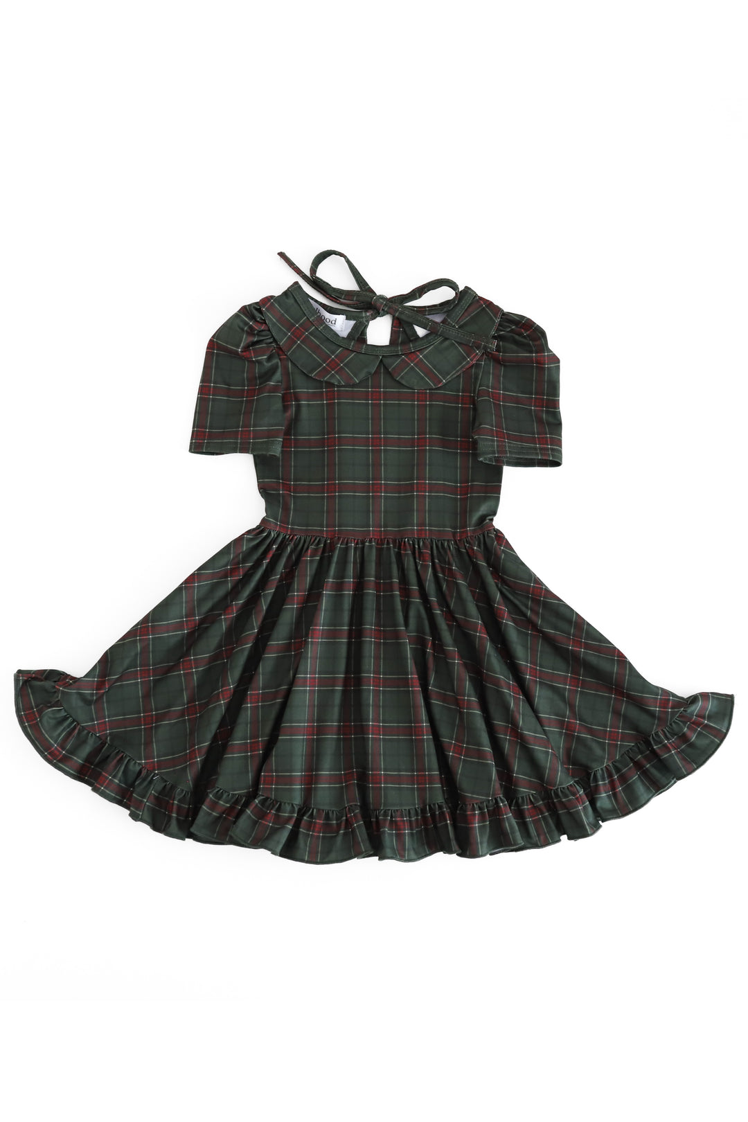 A short-sleeve plaid dress for toddlers or girls, featuring a dark green base with red and white tartan lines. It has a Peter Pan collar, ruffled shoulders, a tie-back neckline, and a flared ruffled skirt, shown against a plain white background.