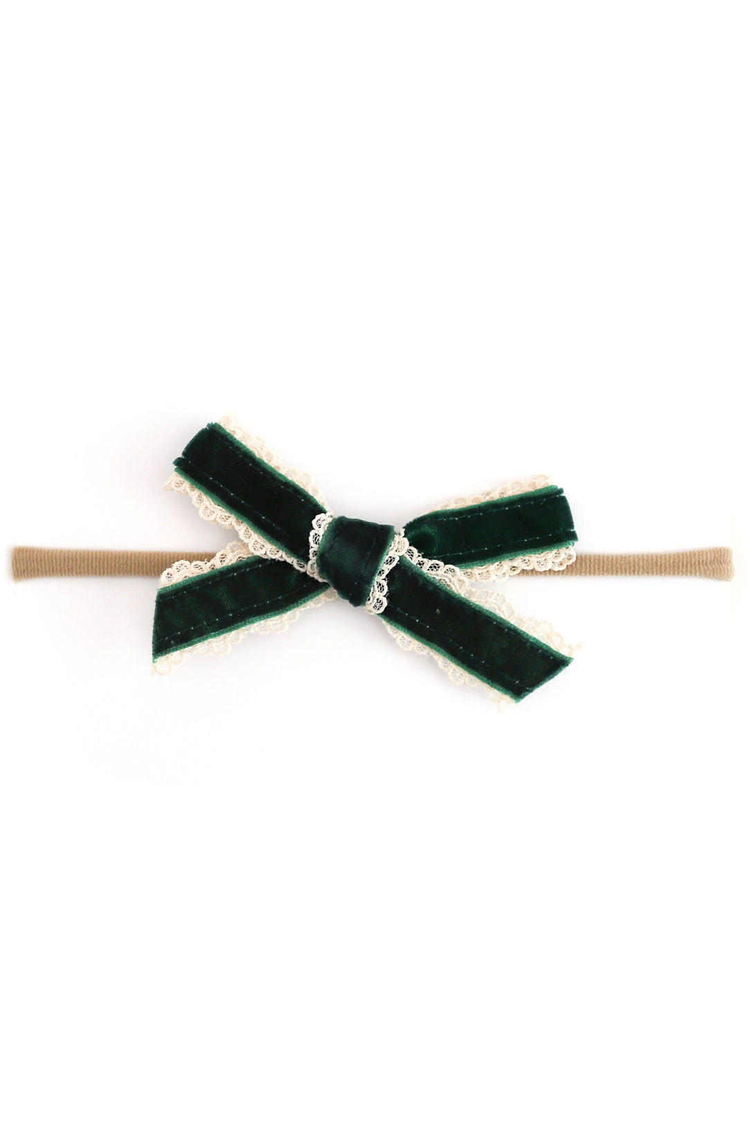 A dark green velvet bow hair tie with a beige elastic band and delicate cream lace trim, shown on a plain white background.