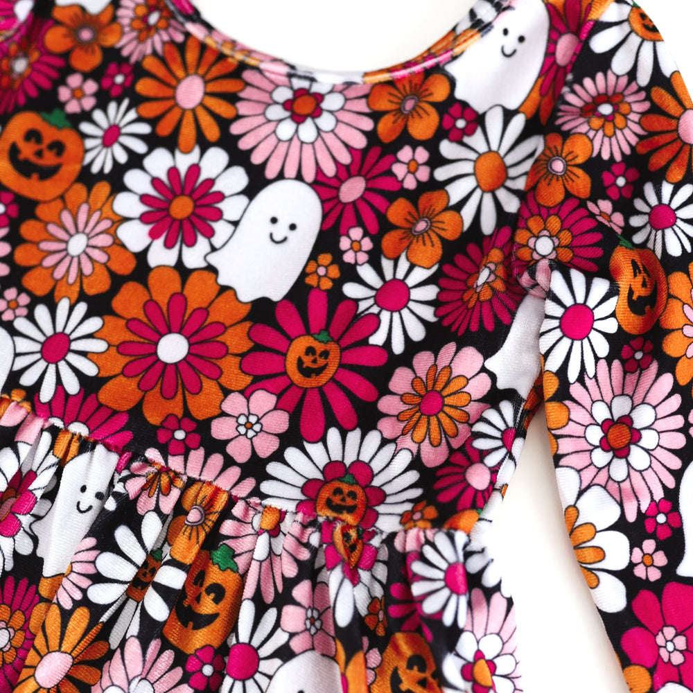 close-up of velvet floral Halloween print with pumpkins and ghosts 