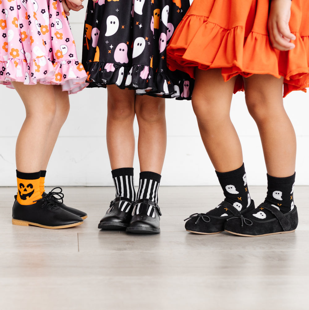 little girls wearing halloween midi socks