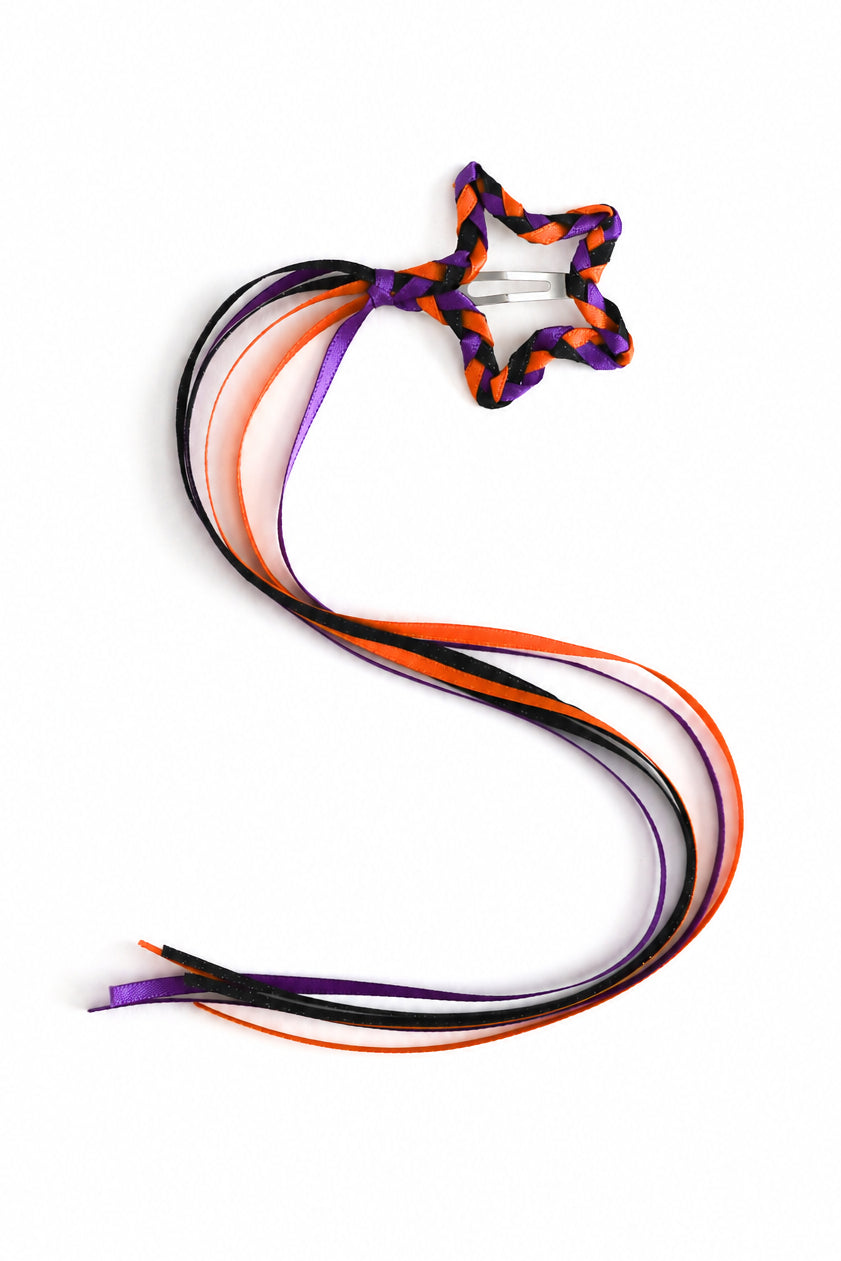 girl's braided star clip with orange, purple and black satin ribbon streamers for Halloween