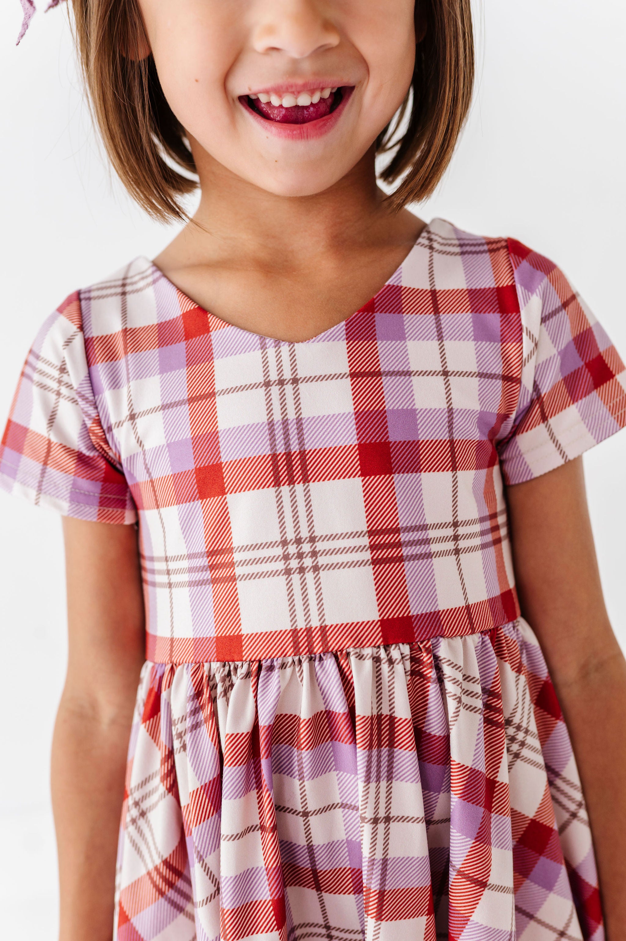 details of girls fall plaid dress with ivory, purple and rust plaid