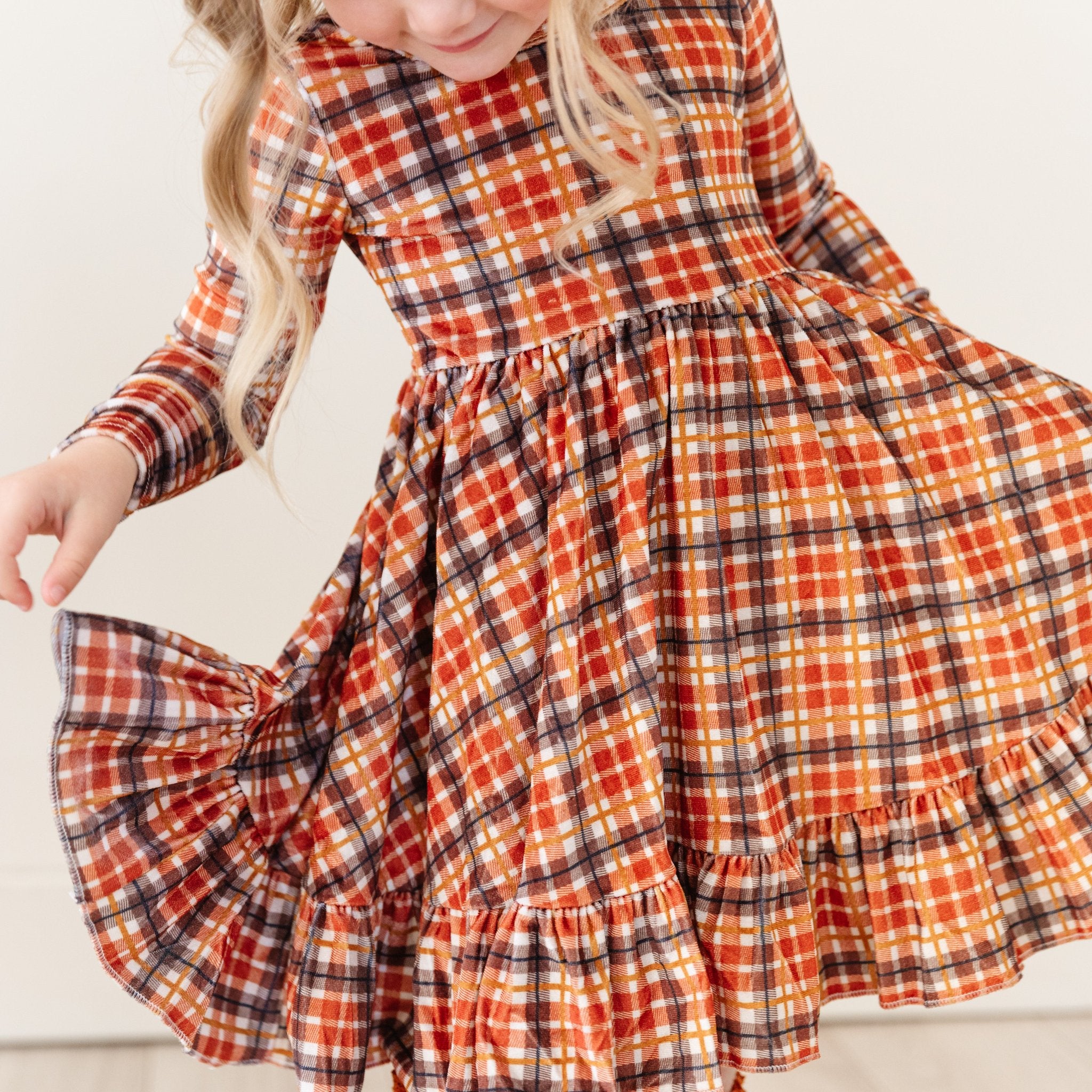 little girl in long sleeve velvet plaid twirl dress with harvest colors palette 