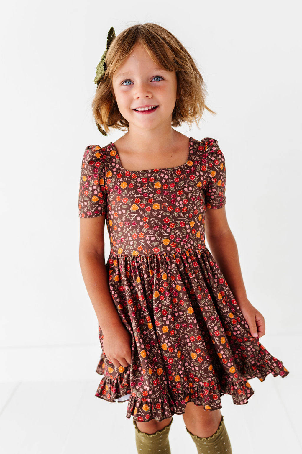girl wearing brown floral dress for fall 2026